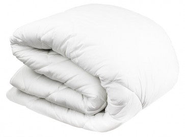 Folded white quilt on a white background